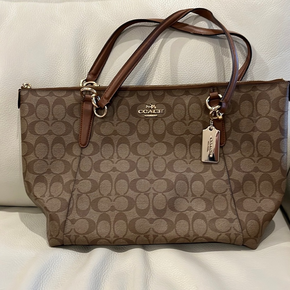This is a newer classic Coach purse.Has pockets to keep your things tucked away.